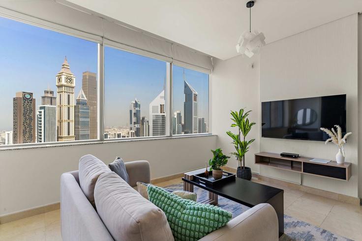 Sala de estar elegantemente projetada com móveis modernos em um apartamento no Building Al Mustaqbal Street - silkhaus - 1323700 em Trade Center, Dubai Sala de estar elegantemente projetada com móveis modernos em um apartamento no Building Al Mustaqbal Street - silkhaus - 1323700 em Trade Center, Dubai