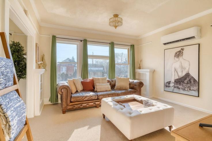 Elegantly designed living room with modern furnishings in an apartment at Building Northeast 29th Avenue - simply-vrm - 1309818 - PDX in Portland, Portland