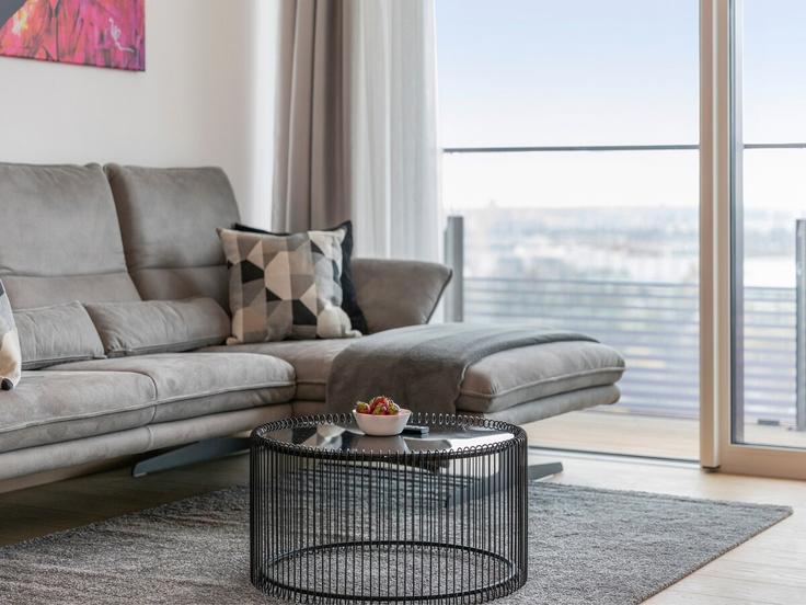 Vienna ViennaのBuilding Thomas-Klestil-Platz - sky9-apartments - 1328514のアパートメントにある、モダンな家具を備えたエレガントなデザインのリビングルーム