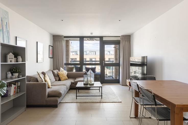 Elegantly designed living room with modern furnishings in an apartment at Building Shepherdess Walk - smart-host-group-ted - 1513454 in London Borough of Hackney, London