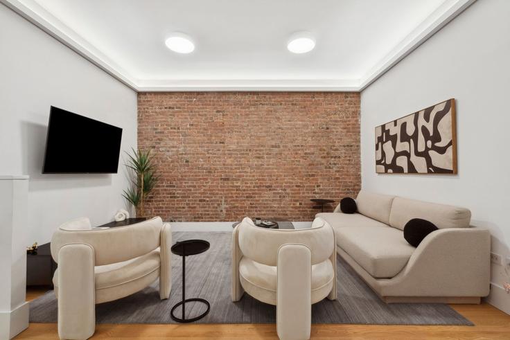 Elegantly designed living room with modern furnishings in an apartment at Building East 84th Street - snsgroup - 1224959 - NYC in Manhattan, New York