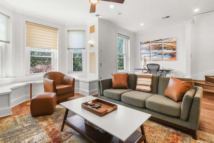 Elegantly designed living room with modern furnishings in an apartment at Building F Street Northeast - sojourn-guesty - 1610213 in Washington, Washington