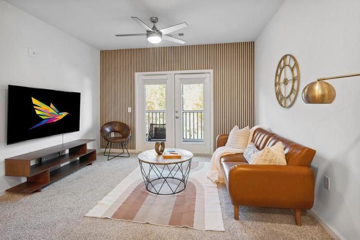 Sala de estar elegantemente projetada com móveis modernos em um apartamento no Building Wildlight Avenue - solace-escapes - 1531858 em Yulee, Yulee Sala de estar elegantemente projetada com móveis modernos em um apartamento no Building Wildlight Avenue - solace-escapes - 1531858 em Yulee, Yulee