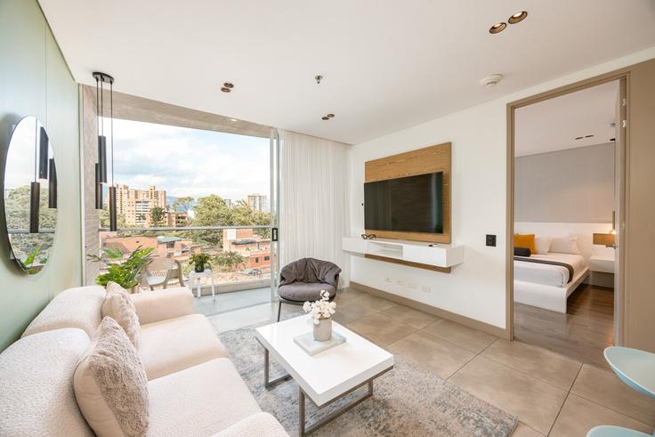 Elegante sala de estar con mobiliario moderno en un apartamento en Building Calle 1b Sur - soul-management-sas - 1321266 en El Poblado, Medellín Elegante sala de estar con mobiliario moderno en un apartamento en Building Calle 1b Sur - soul-management-sas - 1321266 en El Poblado, Medellín