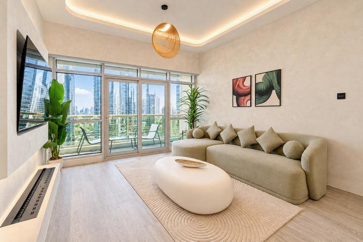 Elegante sala de estar con mobiliario moderno en un apartamento en Building AG Tower - stay-group-2 - 1644423 en Al Thanyah Fifth, Dubai Elegante sala de estar con mobiliario moderno en un apartamento en Building AG Tower - stay-group-2 - 1644423 en Al Thanyah Fifth, Dubai