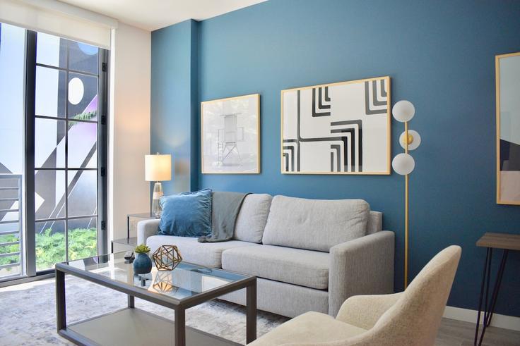 Elegantly designed living room with modern furnishings in an apartment at Building Northwest 24th Street - stay-with-vibe - 1696213 in Miami, Miami