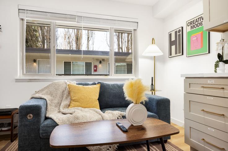 Elegantly designed living room with modern furnishings in an apartment at Building Dravus Street - stayoo-dravus-llc - 1575163 in Seattle, Seattle