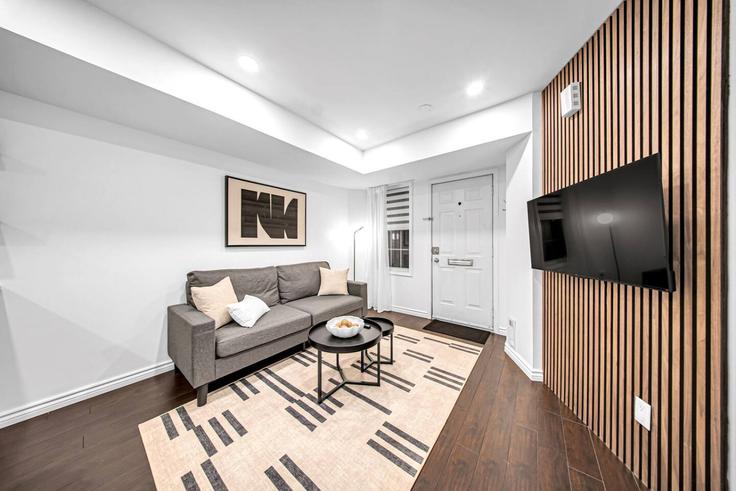 Elegantly designed living room with modern furnishings in an apartment at Building Niagara Street - stayrentx - 1514871 in Old Toronto, Toronto