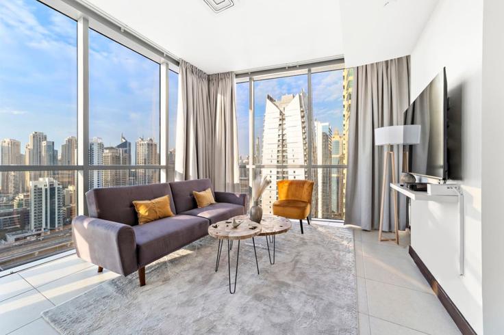 Dubai JLTのBuilding Cluster D - stonetree-vacation-homes - 1316975 - DXBのアパートメントにある、モダンな家具を備えたエレガントなデザインのリビングルーム