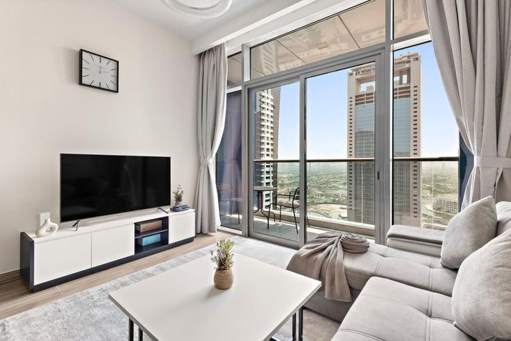 Salle de séjour élégante avec mobilier moderne dans un appartement à Building Cluster K - stonetree-vacation-homes - 1317030 - DXB à JLT, Dubai