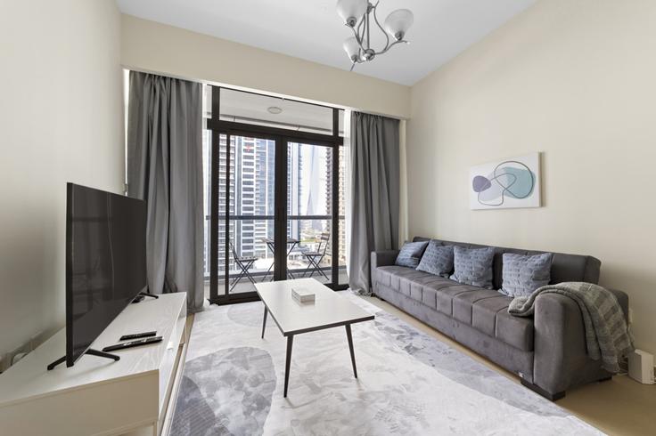 Dubai JLTのBuilding Cluster A - stonetree-vacation-homes - 1317163 - DXBのアパートメントにある、モダンな家具を備えたエレガントなデザインのリビングルーム