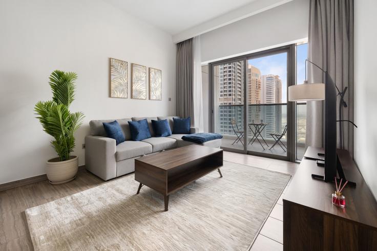 Salle de séjour élégante avec mobilier moderne dans un appartement à Building Cluster K - stonetree-vacation-homes - 1317193 - DXB à JLT, Dubai