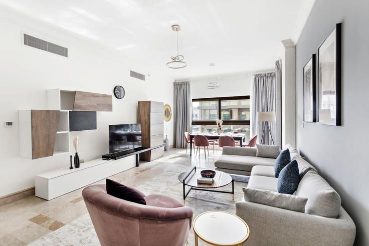 Elegantly designed living room with modern furnishings in an apartment at Building Tariaq Bedon Esm - stonetree-vacation-homes - 1317313 - DXB in Nakhlat Jumeira, Dubai Elegantly designed living room with modern furnishings in an apartment at Building Tariaq Bedon Esm - stonetree-vacation-homes - 1317313 - DXB in Nakhlat Jumeira, Dubai