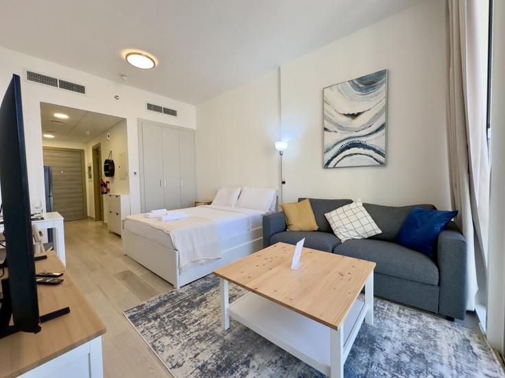 Elegantly designed living room with modern furnishings in an apartment at Building Lazuward South West - stonetree-vacation-homes - 1317314 - DXB in Al Barsha South Fourth, Dubai