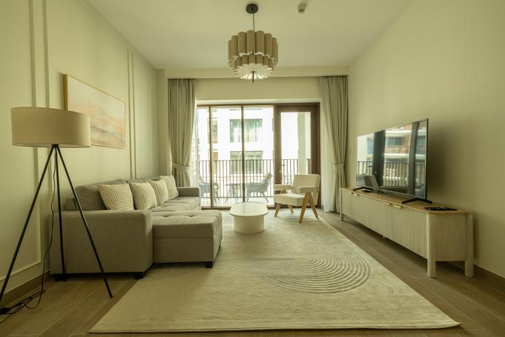 Salle de séjour élégante avec mobilier moderne dans un appartement à Building Tariaq Bedon Esm - stonetree-vacation-homes - 1335701 à Al Kheeran First, Dubai Salle de séjour élégante avec mobilier moderne dans un appartement à Building Tariaq Bedon Esm - stonetree-vacation-homes - 1335701 à Al Kheeran First, Dubai