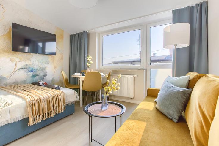 Sala de estar elegantemente projetada com móveis modernos em um apartamento no Building Rotmistrza Witolda Pileckiego - superapart - 1298685 - POL em Warsaw, Warsaw Sala de estar elegantemente projetada com móveis modernos em um apartamento no Building Rotmistrza Witolda Pileckiego - superapart - 1298685 - POL em Warsaw, Warsaw