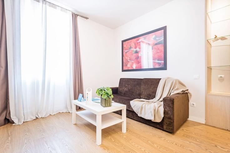 Elegante sala de estar con mobiliario moderno en un apartamento en Building Carrer de Villarroel - sweett - 1053512 - BCN en Eixample, Barcelona Elegante sala de estar con mobiliario moderno en un apartamento en Building Carrer de Villarroel - sweett - 1053512 - BCN en Eixample, Barcelona