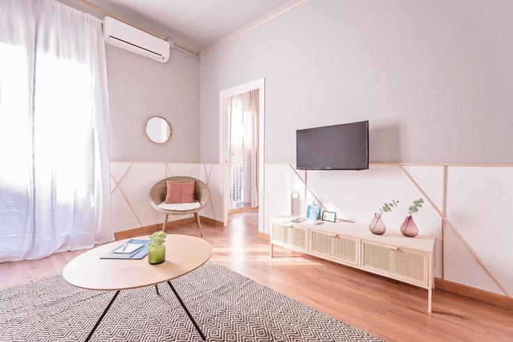 Salle de séjour élégante avec mobilier moderne dans un appartement à Building Carrer de Rocafort - sweett - 1053579 - BCN à Eixample, Barcelona