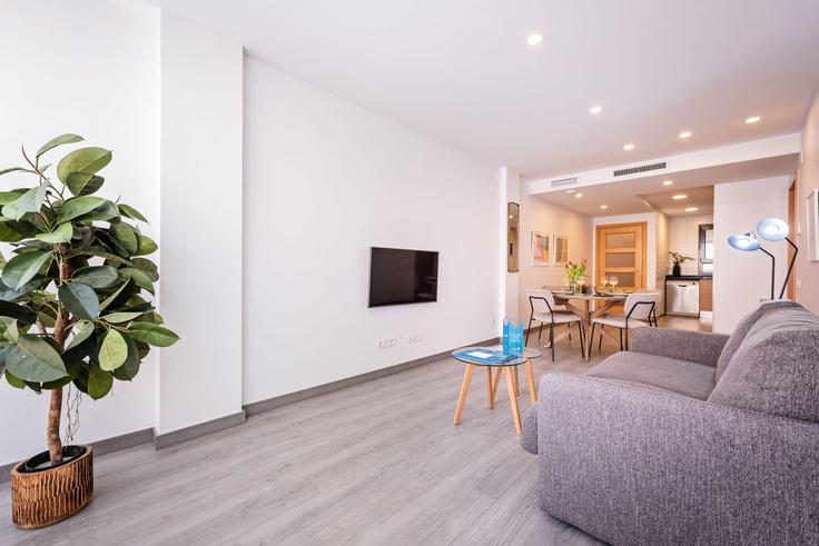 Sala de estar elegantemente projetada com móveis modernos em um apartamento no Building Carrer de València - sweett - 1054005 - BCN em Eixample, Barcelona Sala de estar elegantemente projetada com móveis modernos em um apartamento no Building Carrer de València - sweett - 1054005 - BCN em Eixample, Barcelona