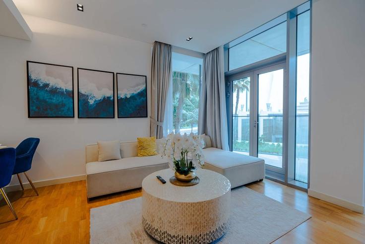 Elegantly designed living room with modern furnishings in an apartment at Building Tariaq Bedon Esm - t-r-p-s-vacation-homes-rental-co-llc - 1324872 in Bluewaters Island, Dubai