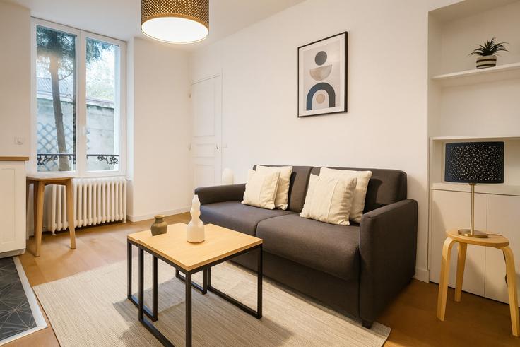Elegante sala de estar con mobiliario moderno en un apartamento en Building Villa de Grenelle - the-flex-paris - 1388326 en 15th arrondissement, Paris