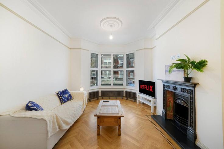 Elegantly designed living room with modern furnishings in an apartment at Building Windsor Road - the-noir-collective - 1634286 in London Borough of Brent, London Elegantly designed living room with modern furnishings in an apartment at Building Windsor Road - the-noir-collective - 1634286 in London Borough of Brent, London