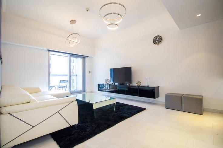 Sala de estar elegantemente projetada com móveis modernos em um apartamento no Building Marina Promenade - the-prive-hospitality-vacation-homes - 1258097 - DXB em Dubai Marina, Dubai Sala de estar elegantemente projetada com móveis modernos em um apartamento no Building Marina Promenade - the-prive-hospitality-vacation-homes - 1258097 - DXB em Dubai Marina, Dubai