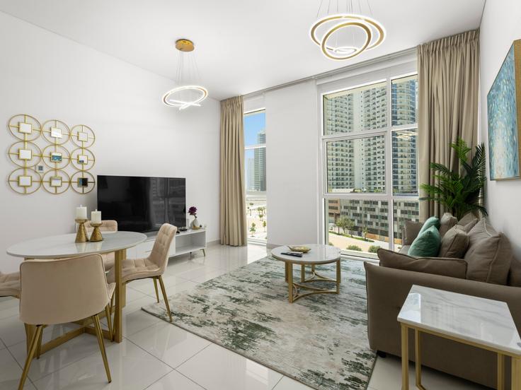 Elegante sala de estar con mobiliario moderno en un apartamento en Building Al Asayel Street - the-prive-hospitality-vacation-homes - 1258166 - DXB en Business Bay, Dubai Elegante sala de estar con mobiliario moderno en un apartamento en Building Al Asayel Street - the-prive-hospitality-vacation-homes - 1258166 - DXB en Business Bay, Dubai