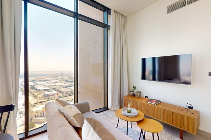 Building Tariaq Bedon Esm - thecommunityhotel-hostaway - 1069219 - DXB adresindeki bir dairede modern mobilyalarla zarif bir şekilde tasarlanmış oturma odası Jumeirah Village, Dubai