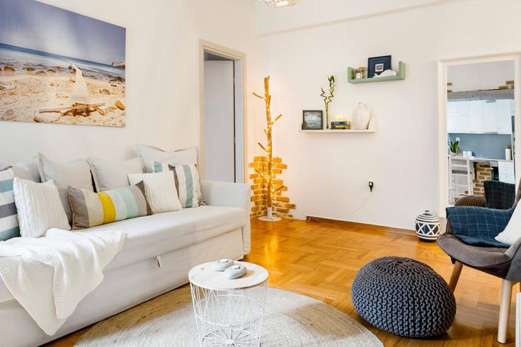Elegantly designed living room with modern furnishings in an apartment at Building Anastasiou Zinni - thehomis - 1358788 in Central Athens, Athens