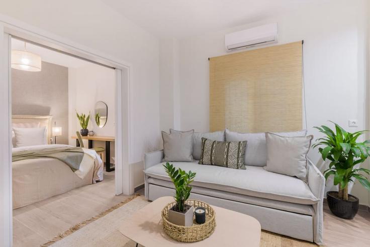 Elegantly designed living room with modern furnishings in an apartment at Building Sorvolou - thehomis - 1358821 in Central Athens, Athens