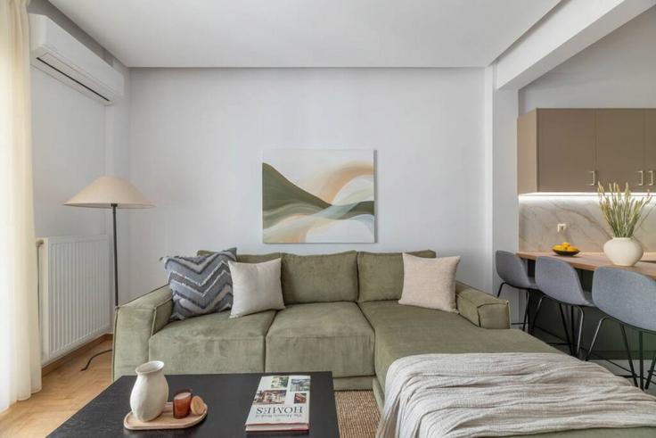 Elegantly designed living room with modern furnishings in an apartment at Building Georgiou Androutsou - thehomis - 1358859 in Central Athens, Athens