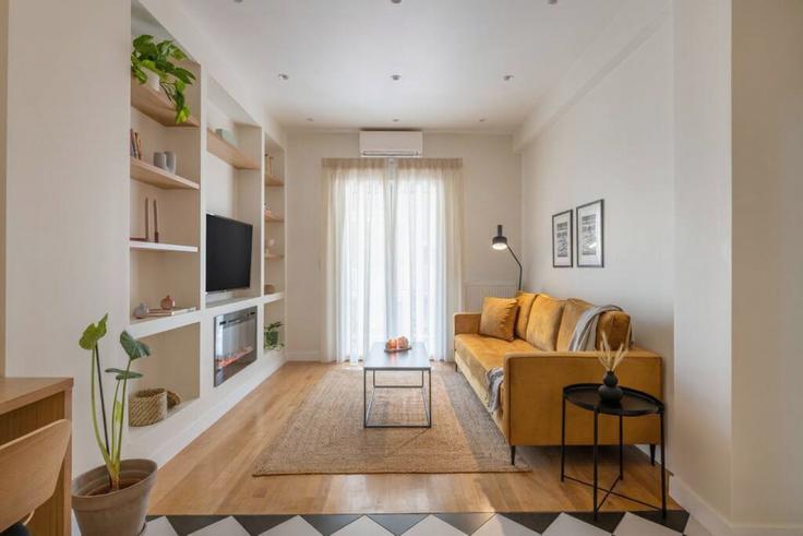 Elegantly designed living room with modern furnishings in an apartment at Building Νικολάου Δημητρακοπούλου - thehomis - 1358852 in Central Athens, Athens Elegantly designed living room with modern furnishings in an apartment at Building Νικολάου Δημητρακοπούλου - thehomis - 1358852 in Central Athens, Athens
