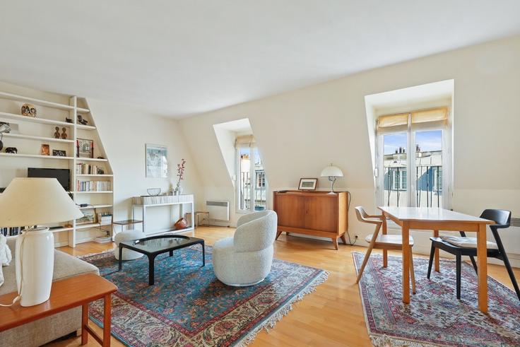 Elegantly designed living room with modern furnishings in an apartment at Building Rue du Cardinal Lemoine - thekonciergerie - 1543005 in 5th arrondissement, Paris
