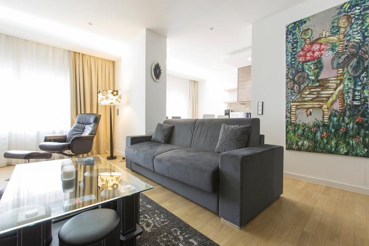 Elegantly designed living room with modern furnishings in an apartment at Building Avenue de la Gare - thequeenluxuryapartments - 1045285 in Luxembourg, Luxembourg