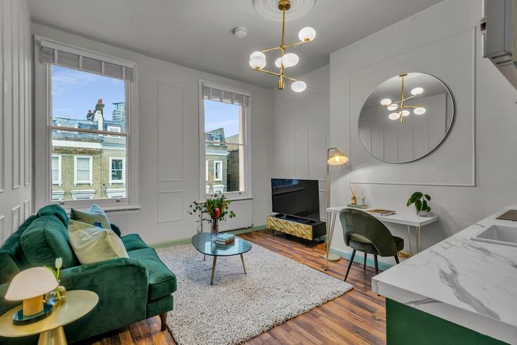 Sala de estar elegantemente projetada com móveis modernos em um apartamento no Building Eardley Crescent - thesquare-serviced-apartments - 1634807 em Royal Borough of Kensington and Chelsea, London Sala de estar elegantemente projetada com móveis modernos em um apartamento no Building Eardley Crescent - thesquare-serviced-apartments - 1634807 em Royal Borough of Kensington and Chelsea, London