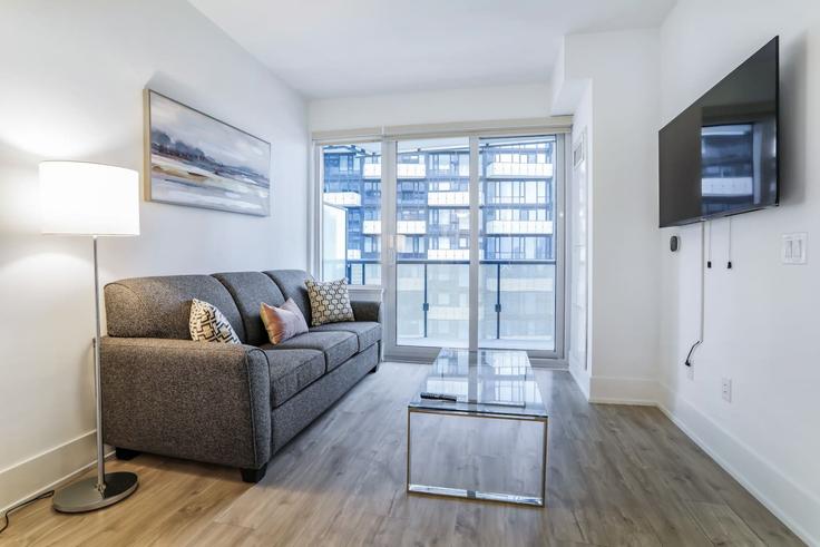 Salle de séjour élégante avec mobilier moderne dans un appartement à Building Front Street West - to-stays-inc - 1471507 à Old Toronto, Toronto Salle de séjour élégante avec mobilier moderne dans un appartement à Building Front Street West - to-stays-inc - 1471507 à Old Toronto, Toronto