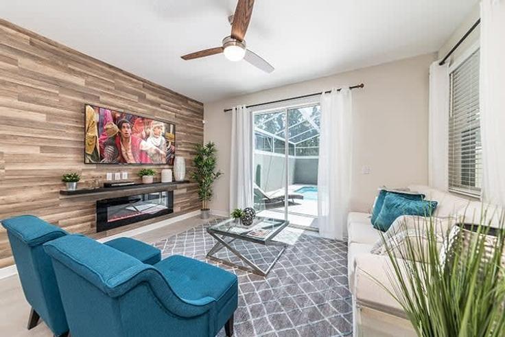 Salle de séjour élégante avec mobilier moderne dans un appartement à Building Ocean Course Avenue - une-homes - 1280826 - MCO à Four Corners, Four Corners Salle de séjour élégante avec mobilier moderne dans un appartement à Building Ocean Course Avenue - une-homes - 1280826 - MCO à Four Corners, Four Corners