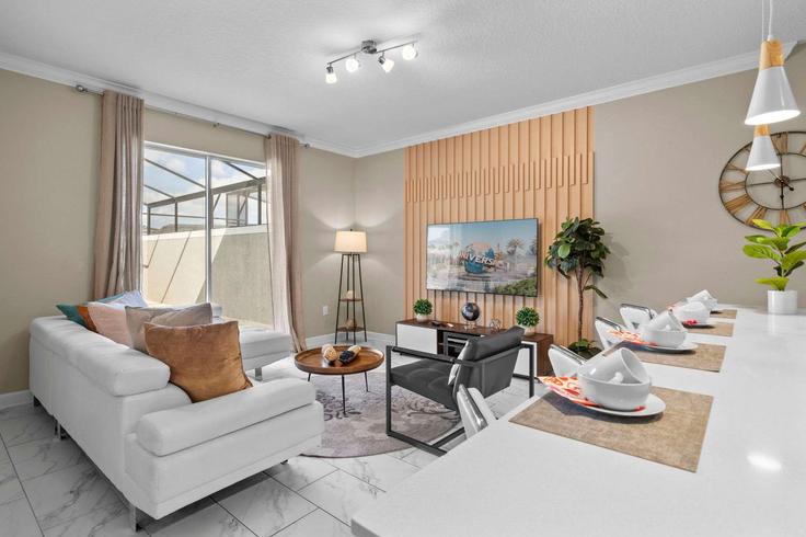 Elegante sala de estar con mobiliario moderno en un apartamento en Building Paragraph Drive - une-homes - 1280946 - MCO en Kissimmee, Kissimmee Elegante sala de estar con mobiliario moderno en un apartamento en Building Paragraph Drive - une-homes - 1280946 - MCO en Kissimmee, Kissimmee