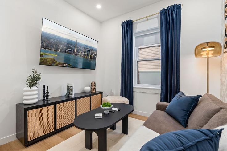 Elegantly designed living room with modern furnishings in an apartment at Building McCaul Street - upstay - 1389233 in Old Toronto, Toronto