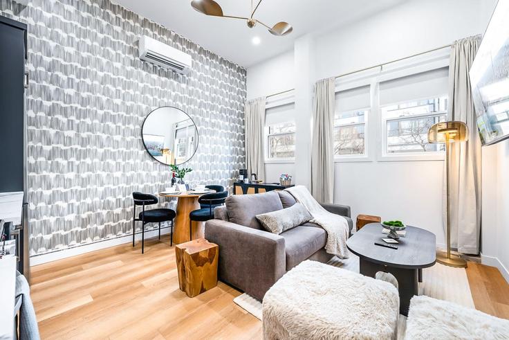 Elegantly designed living room with modern furnishings in an apartment at Building McCaul Street - upstay - 1389231 in Old Toronto, Toronto