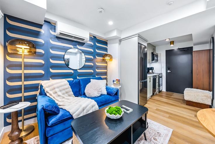 Elegantly designed living room with modern furnishings in an apartment at Building McCaul Street - upstay - 1389232 in Old Toronto, Toronto