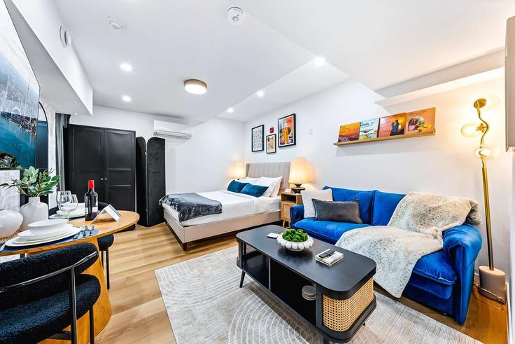 Elegantly designed living room with modern furnishings in an apartment at Building McCaul Street - upstay - 1389235 in Old Toronto, Toronto