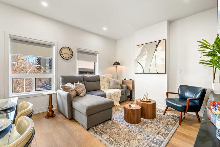 Elegantly designed living room with modern furnishings in an apartment at Building McCaul Street - upstay - 1066570 - TOR in Old Toronto, Toronto