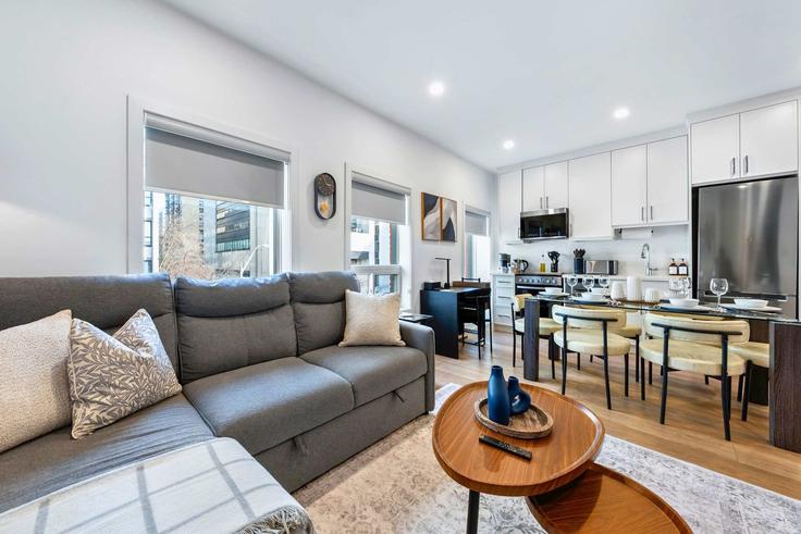 Elegantly designed living room with modern furnishings in an apartment at Building McCaul Street - upstay - 1066571 - TOR in Old Toronto, Toronto