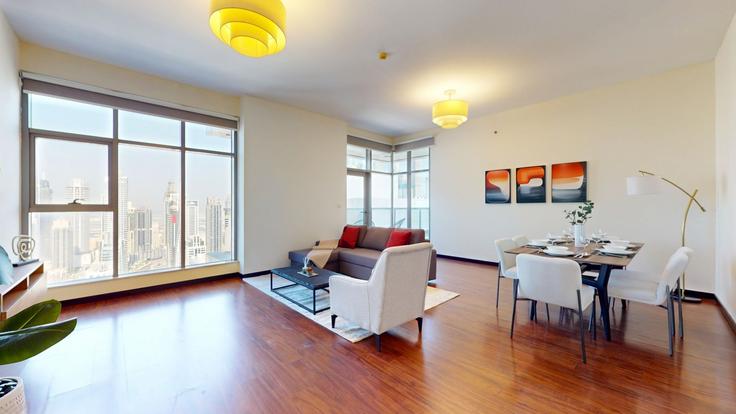 Salle de séjour élégante avec mobilier moderne dans un appartement à Building Green Lakes 2 - vacationer - 1647136 à Al Thanyah Fifth, Dubai Salle de séjour élégante avec mobilier moderne dans un appartement à Building Green Lakes 2 - vacationer - 1647136 à Al Thanyah Fifth, Dubai