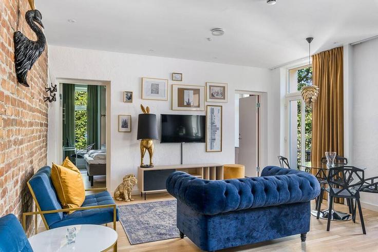 Sala de estar elegantemente projetada com móveis modernos em um apartamento no Building Trondheimsveien - vanderoslo - 1226715 - NOR em Oslo, Oslo Sala de estar elegantemente projetada com móveis modernos em um apartamento no Building Trondheimsveien - vanderoslo - 1226715 - NOR em Oslo, Oslo