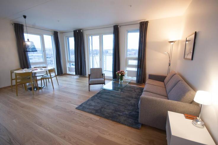 Sala de estar elegantemente projetada com móveis modernos em um apartamento no Building Sørenga - vanderoslo - 1226713 - NOR em Oslo, Oslo Sala de estar elegantemente projetada com móveis modernos em um apartamento no Building Sørenga - vanderoslo - 1226713 - NOR em Oslo, Oslo