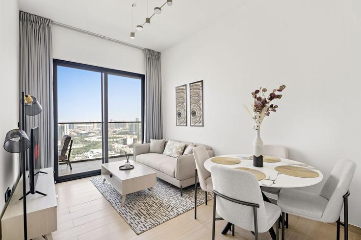 Elegantly designed living room with modern furnishings in an apartment at Building Street 11 - vayk-vacation-homes-rental-llc - 1257282 - DXB in Jumeirah Village, Dubai Elegantly designed living room with modern furnishings in an apartment at Building Street 11 - vayk-vacation-homes-rental-llc - 1257282 - DXB in Jumeirah Village, Dubai