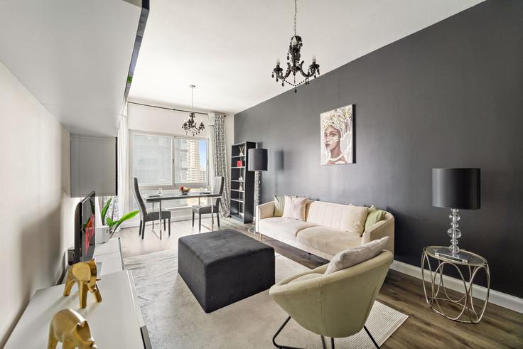 Elegantly designed living room with modern furnishings in an apartment at Building Al Sayorah Street - vayk-vacation-homes-rental-llc - 1257332 - DXB in Dubai Marina, Dubai Elegantly designed living room with modern furnishings in an apartment at Building Al Sayorah Street - vayk-vacation-homes-rental-llc - 1257332 - DXB in Dubai Marina, Dubai